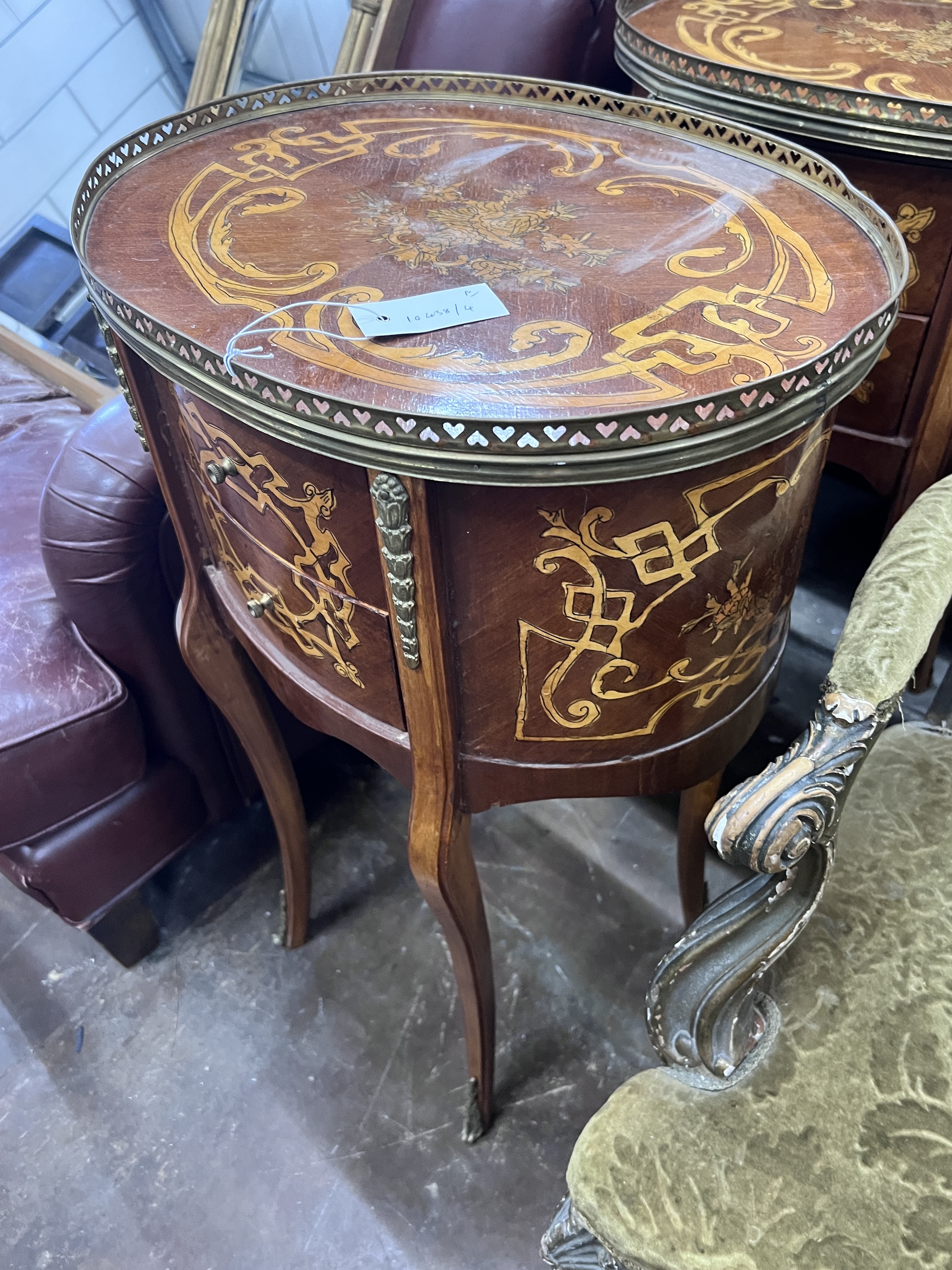 A pair of reproduction Louis XV style oval marquetry inlaid bedside chests, width 47cm, depth 36cm, height 77cm